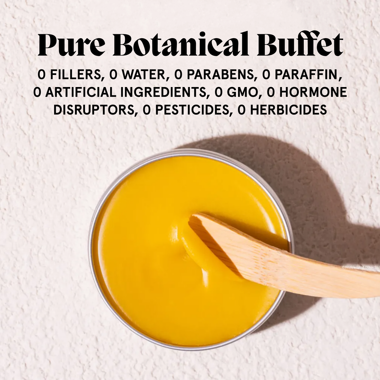 Open Acne Killer balm with bamboo spatula beside a free-from Pure Botanical Buffet graphic